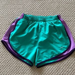 Teal and purple Nike running shorts